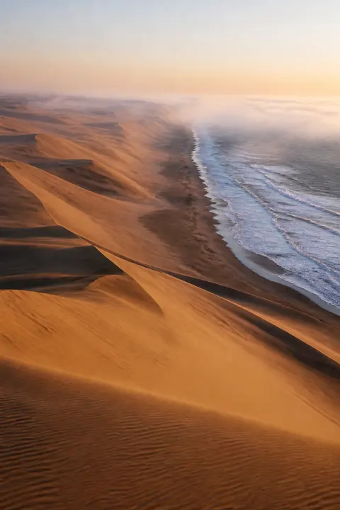 Desert Dunes Meeting the Atlantic Surf