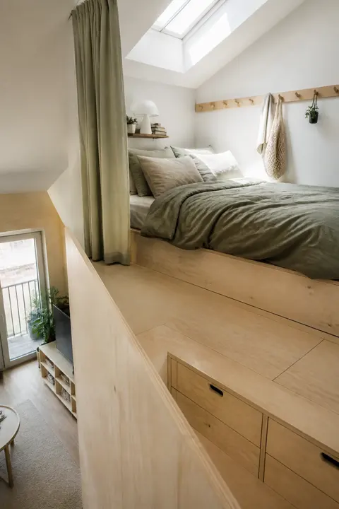 Tiny Raised Bedroom Nook with Built In Storage