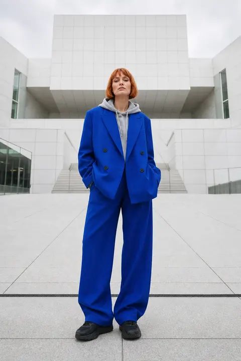 Cobalt Trouser Suit Layered over a Gray Hoodie