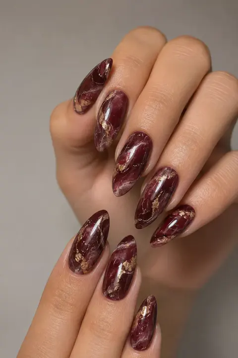 Burgundy Marble Almond Nails with Gold Foil