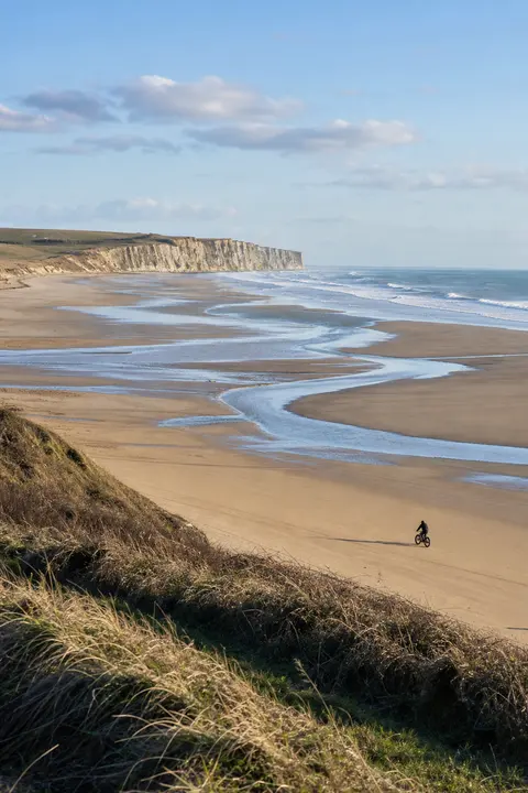 Vast Tidal Beach Beneath Chalk Cliffs