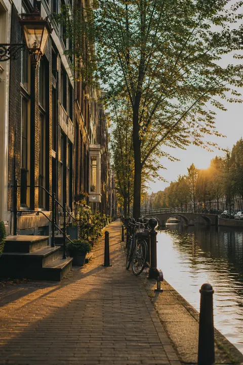 Golden-Hour View of Amsterdam Canal House Street