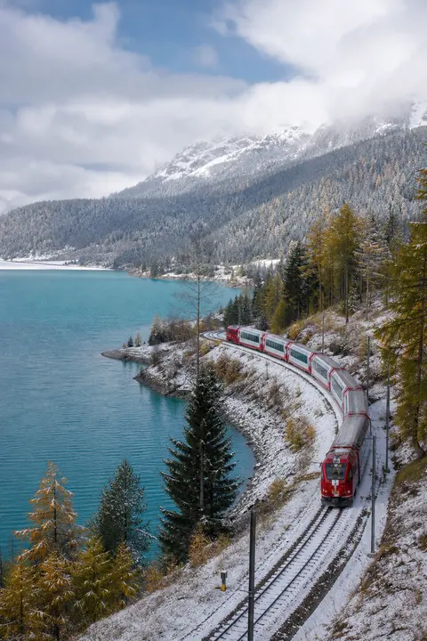 Alpine Train Beside a Turquoise Lake