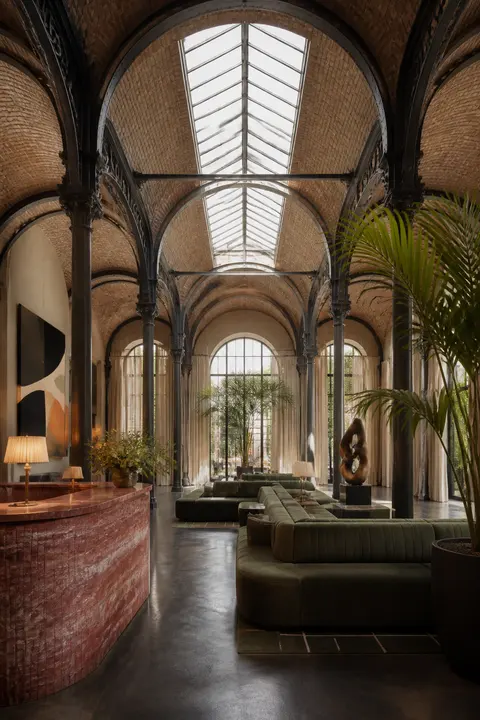 Boutique Hotel Lobby Beneath a Glass Arcade