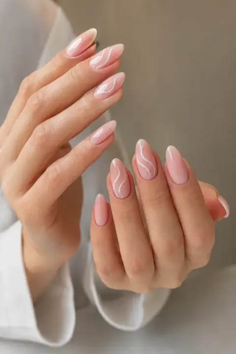 Milky Pink Almond Nails with White Wavy Lines
