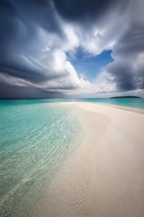 Clearing Weather over Maldives Lagoon Sandbar