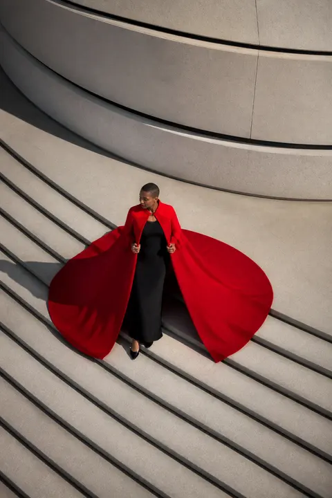 Scarlet Cape with a Dramatic Circular Sweep