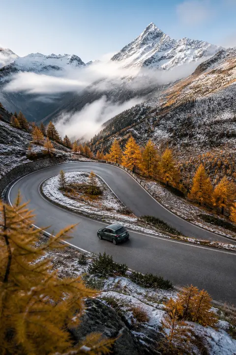 Snowy Alpine Pass Through Golden Larches