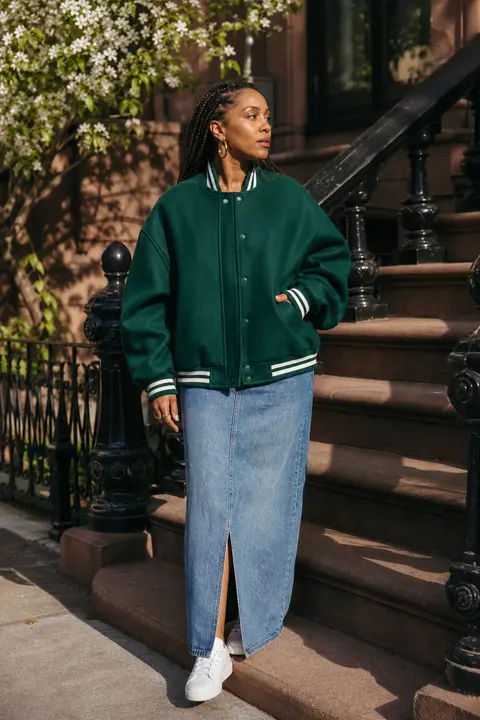 Emerald Varsity Jacket with a Denim Maxi Skirt
