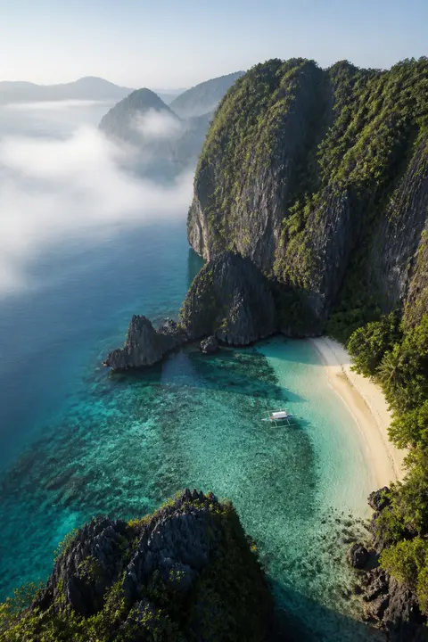 Hidden Tropical Cove Beneath Jungle Cliffs